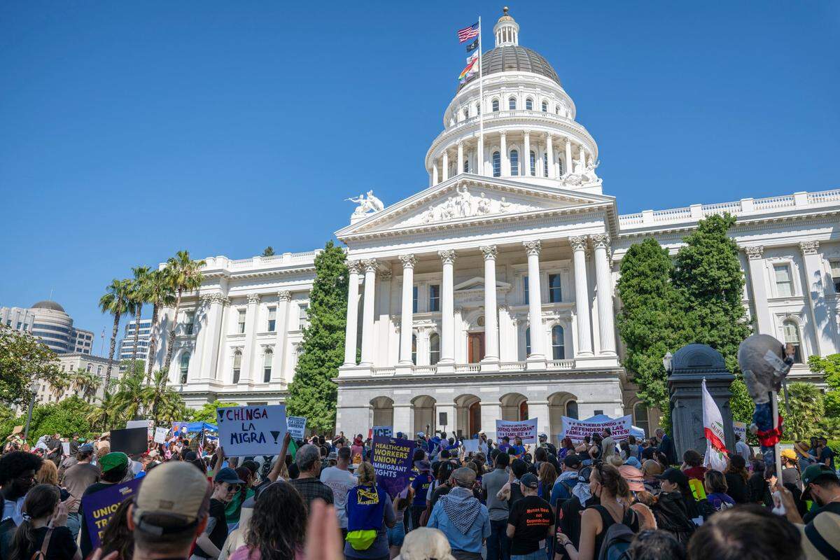 Marchers celebrate Monday after reaching the state Capitol in downtown  Sacramento after a three-day walk from Vacaville in support of immigrant rights.