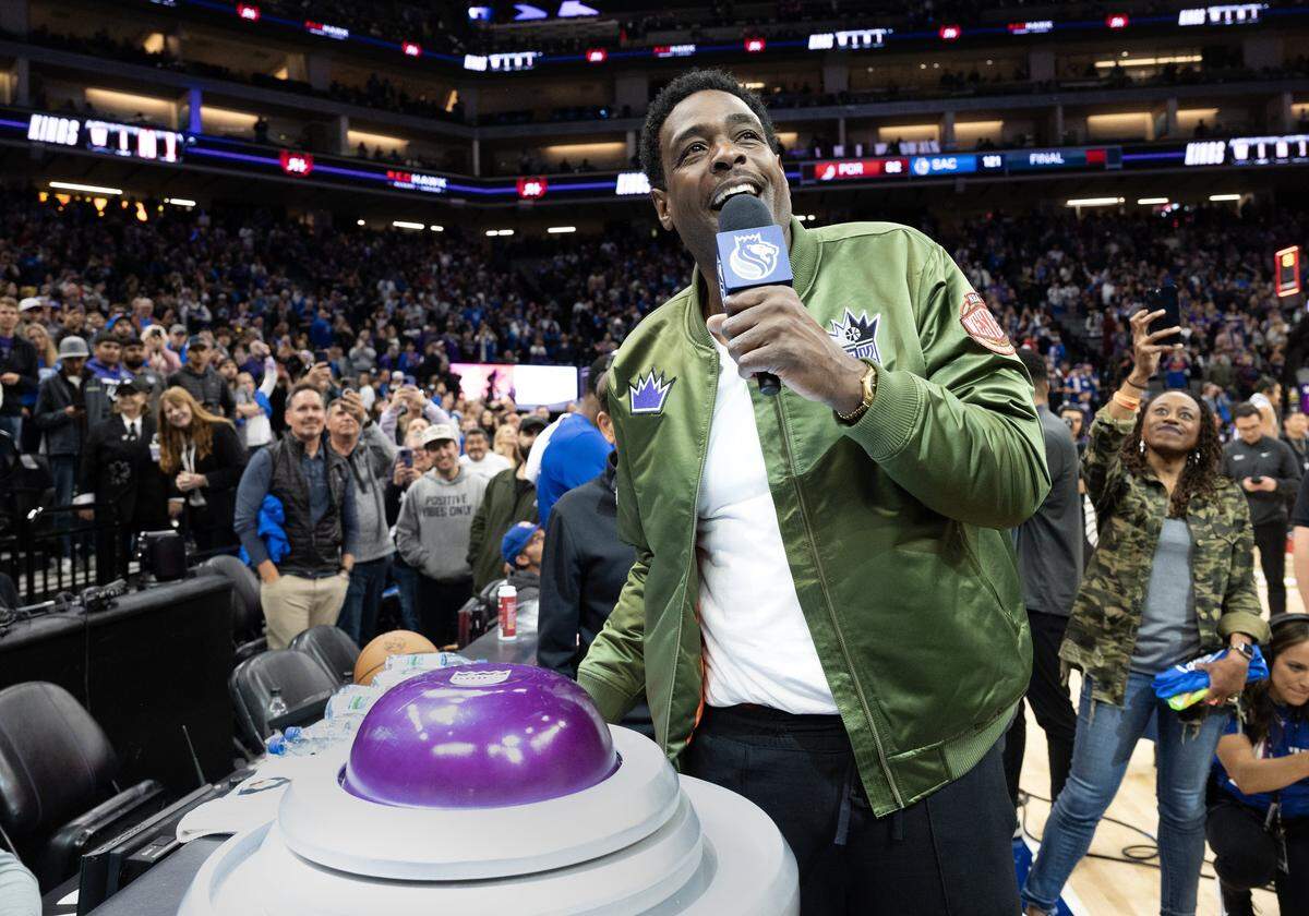 Former Sacramento Kings star Chris Webber talks with fans before lighting the beam with owner Vivek Ranadivé after the Sacramento Kings beat the Portland Trail Blazers 121-82 at Golden 1 Center on Sunday, April 14, 2024.