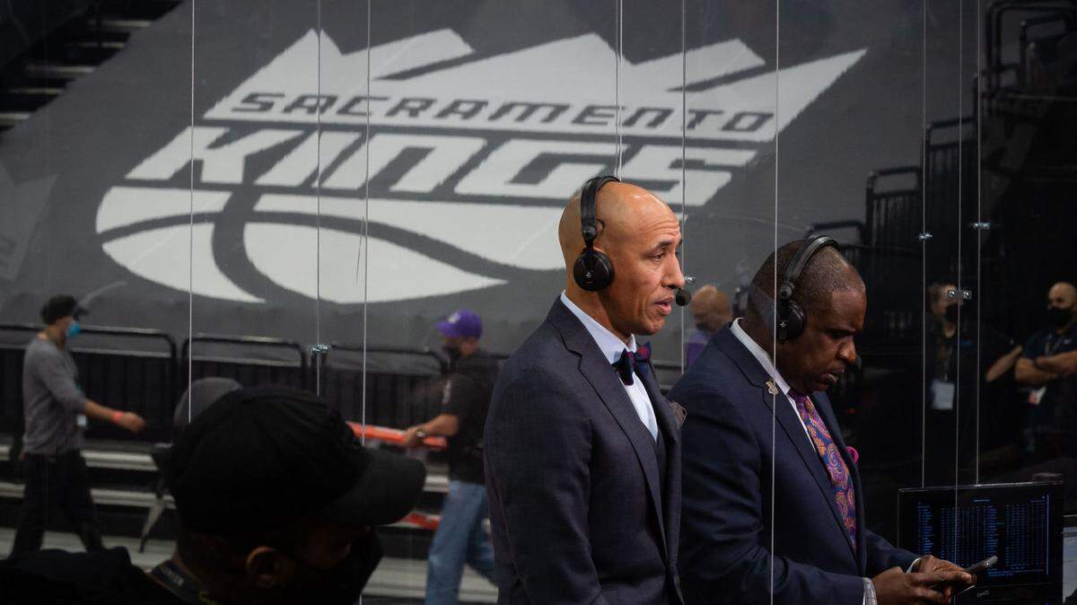 Sacramento Kings TV Color Analyst Doug Christie speaks while separated from others with clear plastic partitions as part of coronavirus protections after their final preseason game Thursday, Dec. 17, 2020, at Golden 1 Center in Sacramento. The Golden State Warriors beat the Kings 113-109.