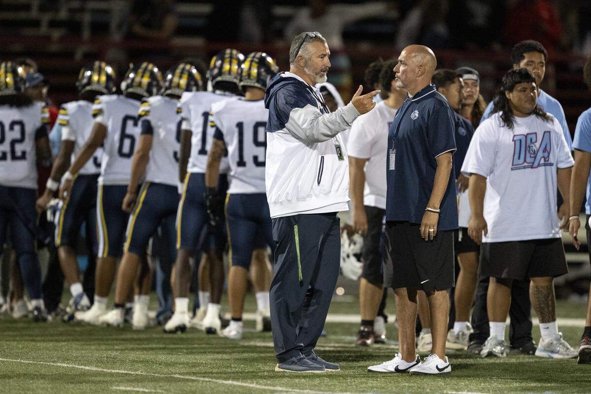 Inderkum Tigers head coach Justin Reber and Destiny Christian Lions head coach Aaron Garcia chat after the game at Destiny Christian Academy in Rosemont on Friday.