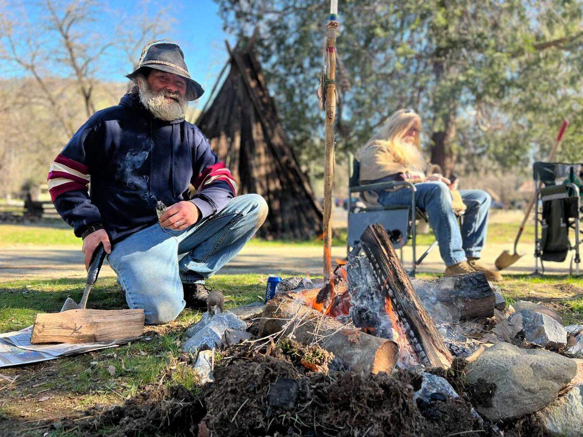 Louis Smith III of the Niesenan and Mi-Wuk tribes performs a smudging ceremony Saturday on native land at Marshall Gold Discovery State Historic Park in Coloma. Smith said tribe members are planting a native garden not far from where James W. Marshall discovered gold.
