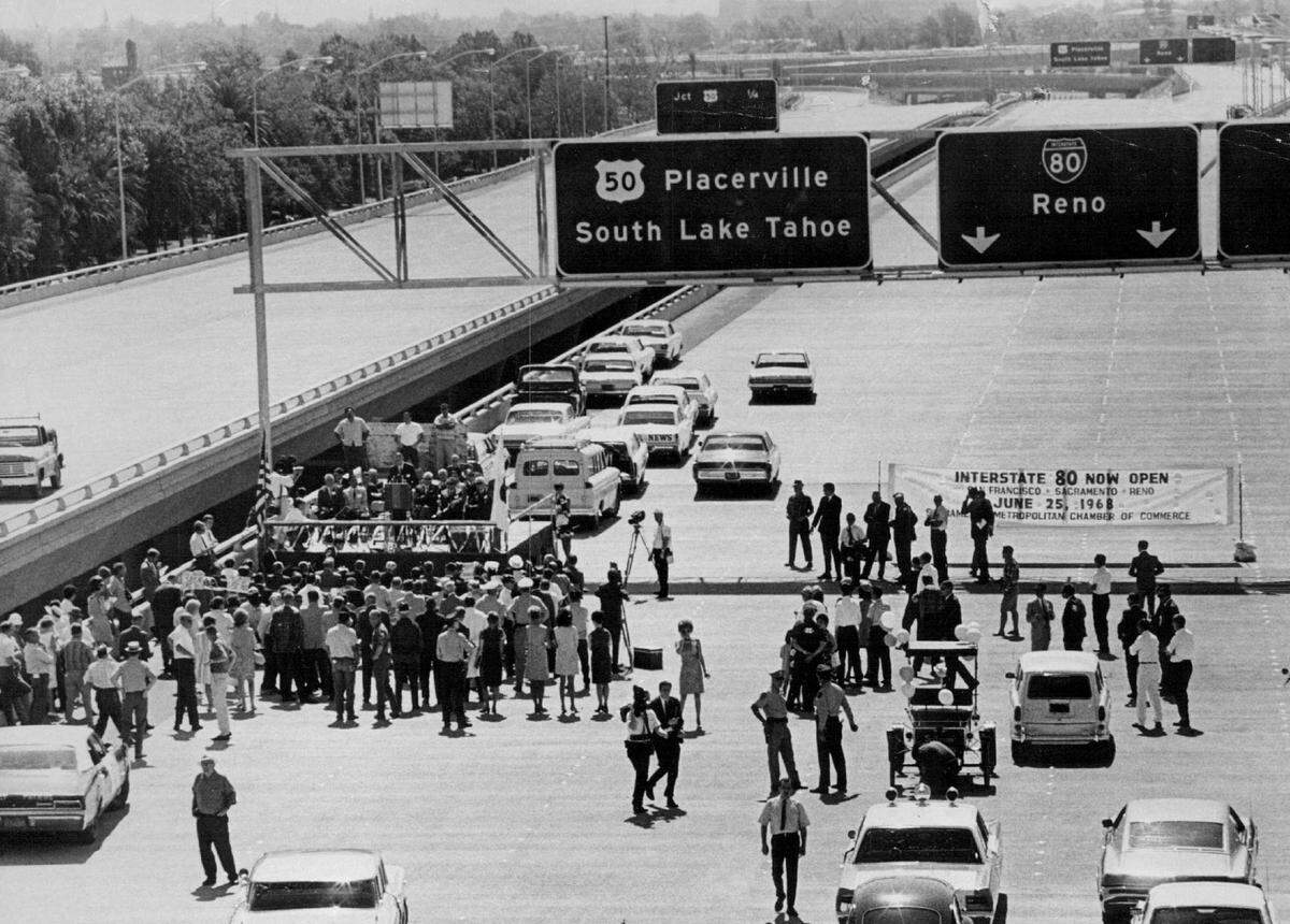 A speaker addresses attendees of the official dedication ceremonies for the vast 20-acre interchange that connected the W-X freeway to Interstate 80 — which ran through the center of Sacramento at the time — and Highway 50 and Highway 99 on June 25, 1968. It was the last link to open between San Francisco and Reno for I-80.