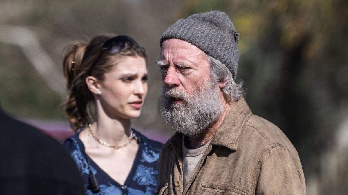 Actor Xander Berkeley, right, waits for the next scene to be filmed for the movie “No Address” in Sacramento’s William Land Park on Wednesday. Berkeley plays the leader of a homeless group who is a war veteran and former addict.