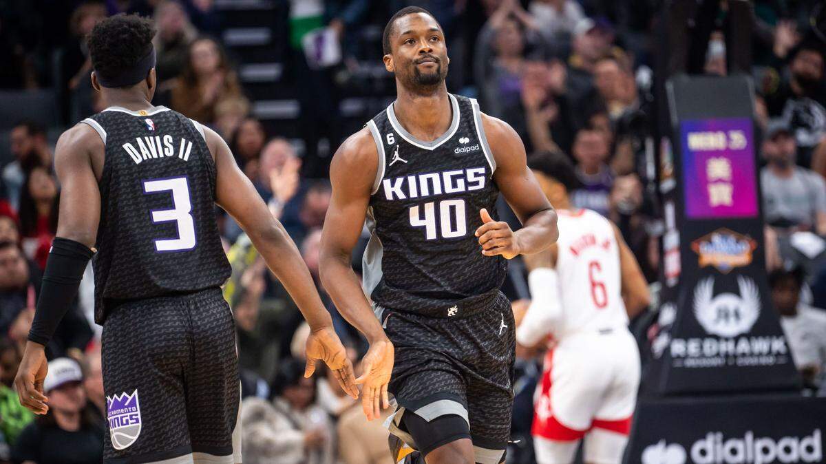 Sacramento Kings forward Harrison Barnes (40) casually accepts congratulations from Sacramento Kings guard Terence Davis II (3) after scoring a three point basket during a run against the Houston Rockets during the fourth quarter of the NBA basketball game Friday, Jan. 13, 2023, at Golden 1 Center in Sacramento.