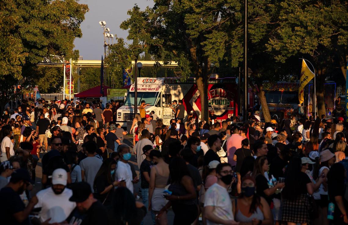 People attend the second of four nights at FoodieLand Night Market for an Asian inspired pop-up festival at Sacramento’s Cal Expo on Saturday, Sept. 4, 2021, featuring food trucks, local art, drinks and entertainment.