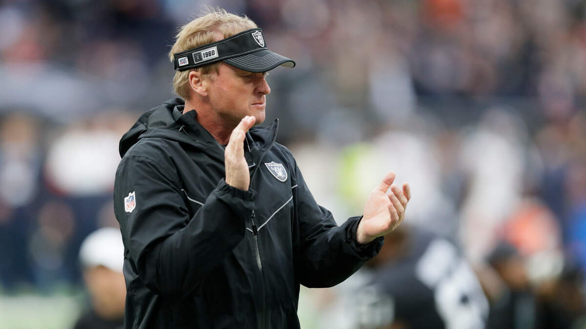 Raiders coach Jon Gruden encourages his team before a game against the Chicago Bears on Oct. 6 in London.
