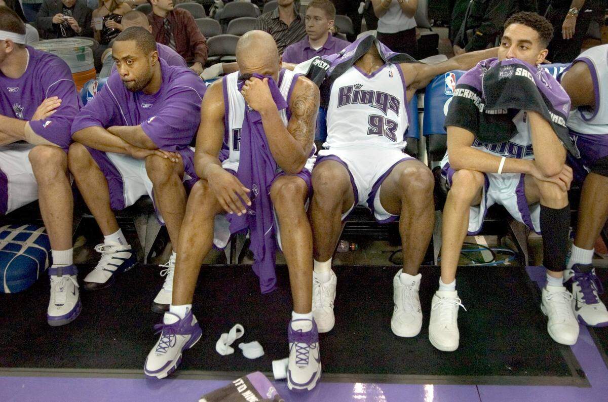 Kenny Thomas, Bonzi Wells, Ron Artest and Kevin Martin sit on the bench in the closing minutes of Game 6 of the first round of Western Conference playoff series between the Sacramento Kings and San Antonio Spurs at Arco Arena on Friday, May 5, 2006.