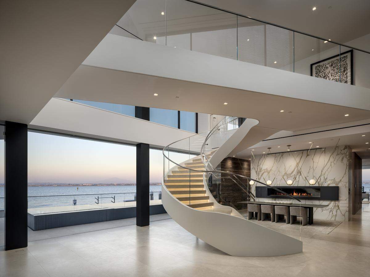 Floor-to-ceiling windows “dissolve boundaries between interior elegance and the ever-changing canvas of bay and sky,” the listing states.