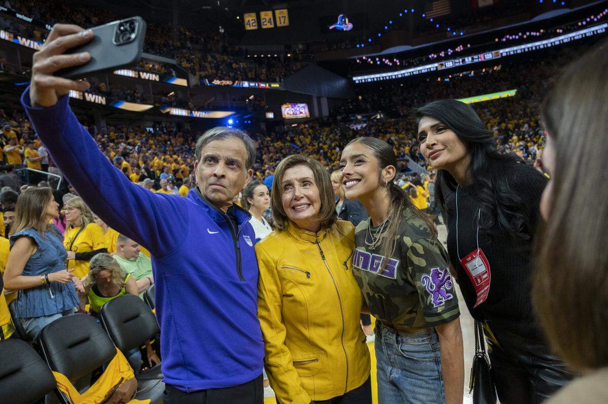 Sacramento Kings owner Vivek Ranadive takes a selfie with Congresswoman Nancy Pelosi, Anjali Ranadive after Game 4 of the first-round NBA playoff series at Chase Center in San Francisco on April 23, 2023.