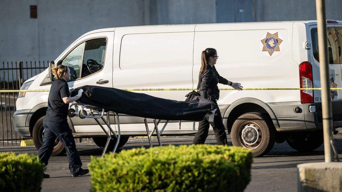The body of a man who was shot dead in south Sacramento is transported to a Sacramento Sheriff’s Coroner van on Wednesday, Oct. 12, 2022. Deputies responded around 4 a.m. to the 5500 block of Sky Parkway to a 911 call reporting the shooting, the Sacramento County Sheriff’s Office said in a news release.