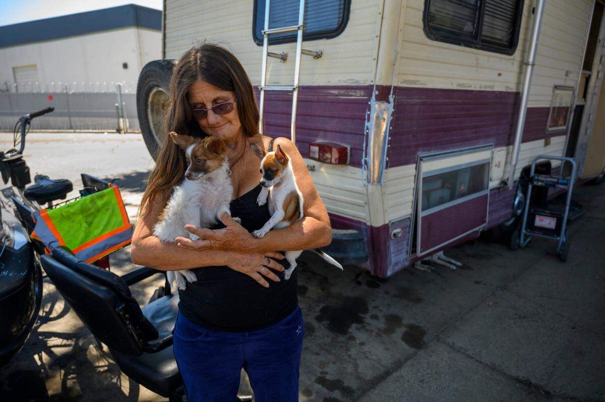 “I’d rather sleep in a home, I couldn’t sleep out here without my dog,” says Gwen Mayse, as she stresses about moving her vehicle in Sacramento in 2019. She and her daughter were told to move their vehicles from Railroad Drive and had no idea where they were going to park.