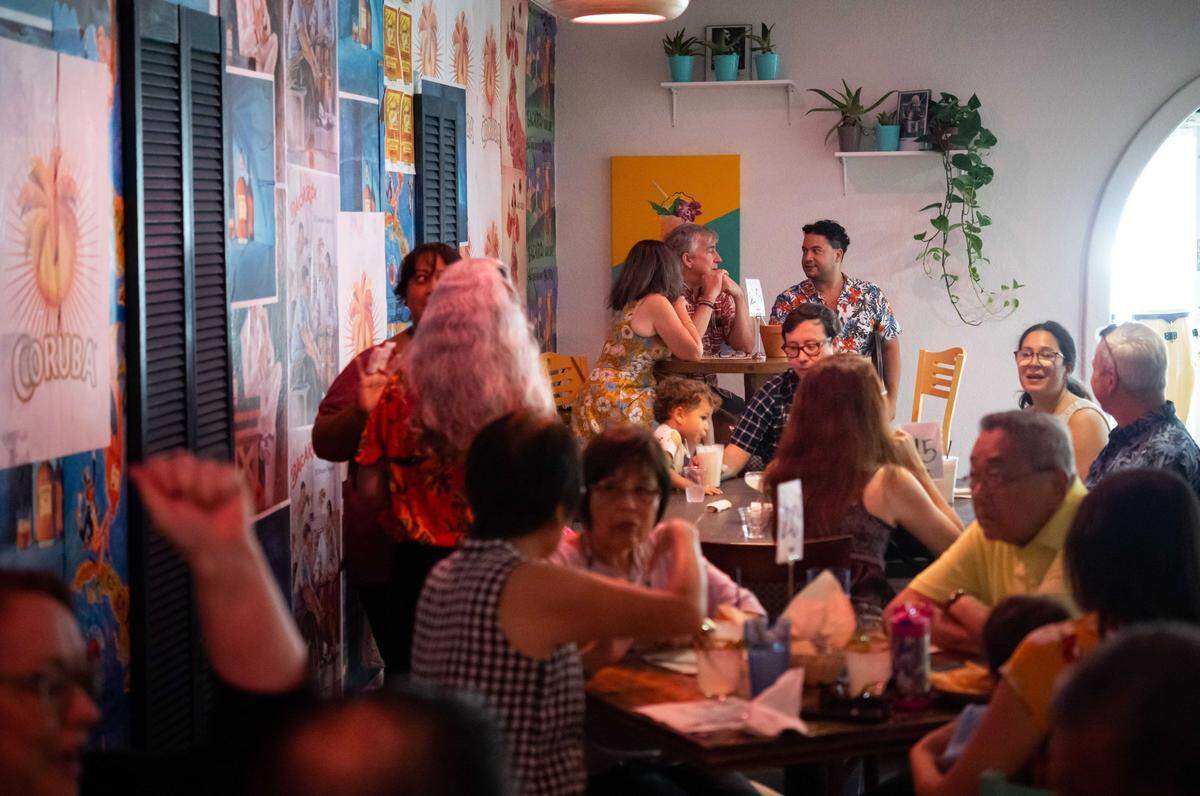Friends and family of owners and staff at Bodega Kitchen & Cocktails enjoy a pre-opening night of service in 2022. The restaurant rooted in Caribbean classics and Puerto Rican family recipes will close Saturday, Nov. 15.