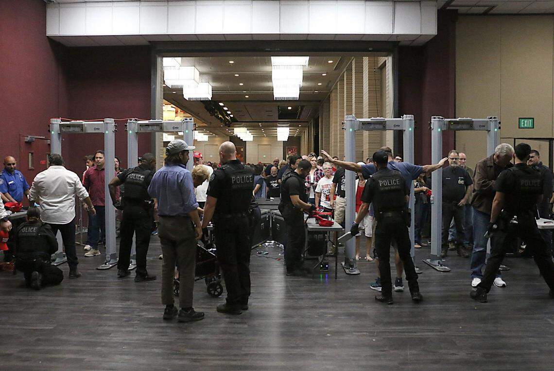 People go through security to see Donald Trump for a rally at the Grand Sierra Resort in Reno on Oct. 11, 2024.