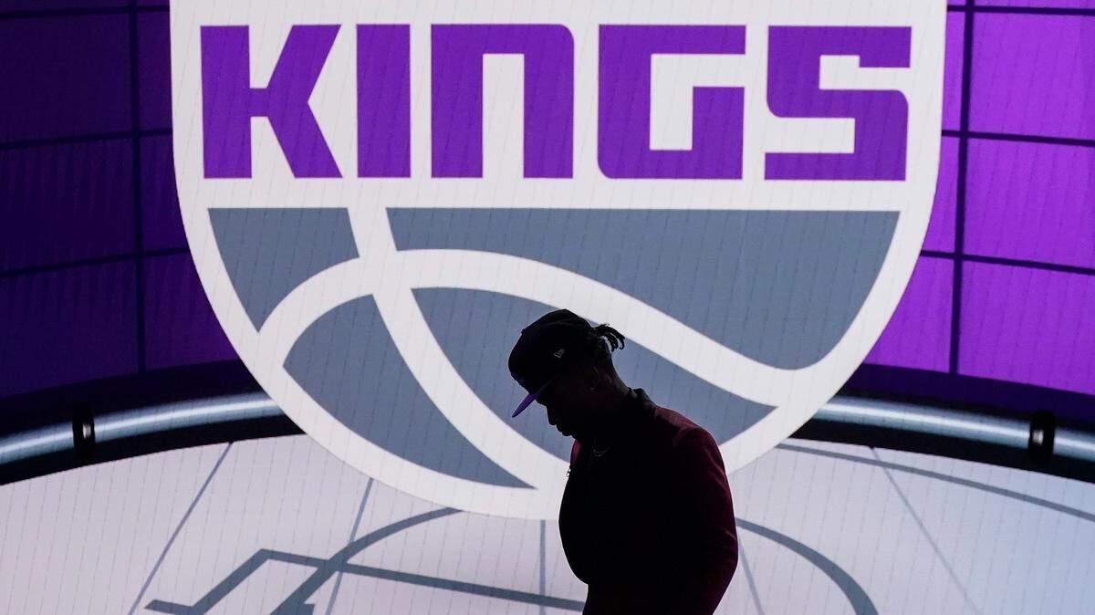 Davion Mitchell steps off the stage after being selected ninth overall by the Sacramento Kings during the NBA basketball draft, Thursday, July 29, 2021, in New York. (AP Photo/Corey Sipkin)