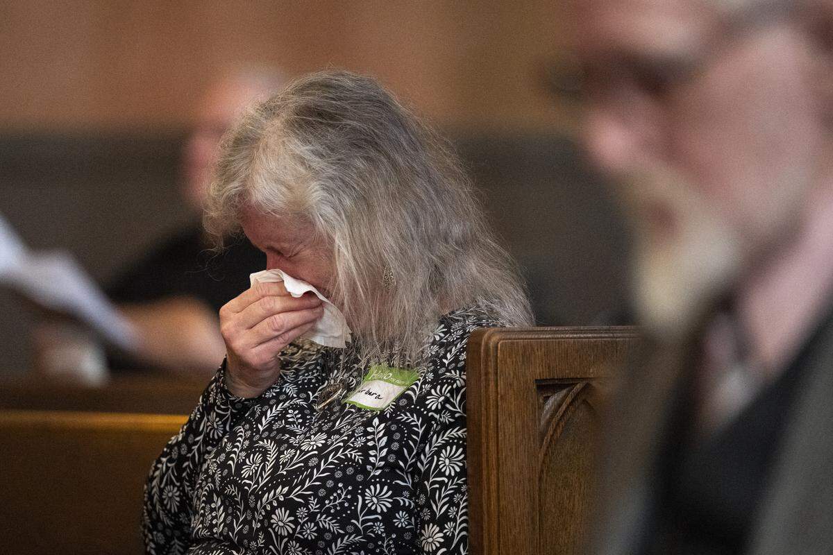 Barbara Renzi wipes her tears during the final service of Pioneer Congregational United Church of Christ at their church on L Street in Sacramento on Sunday, May 31, 2026.