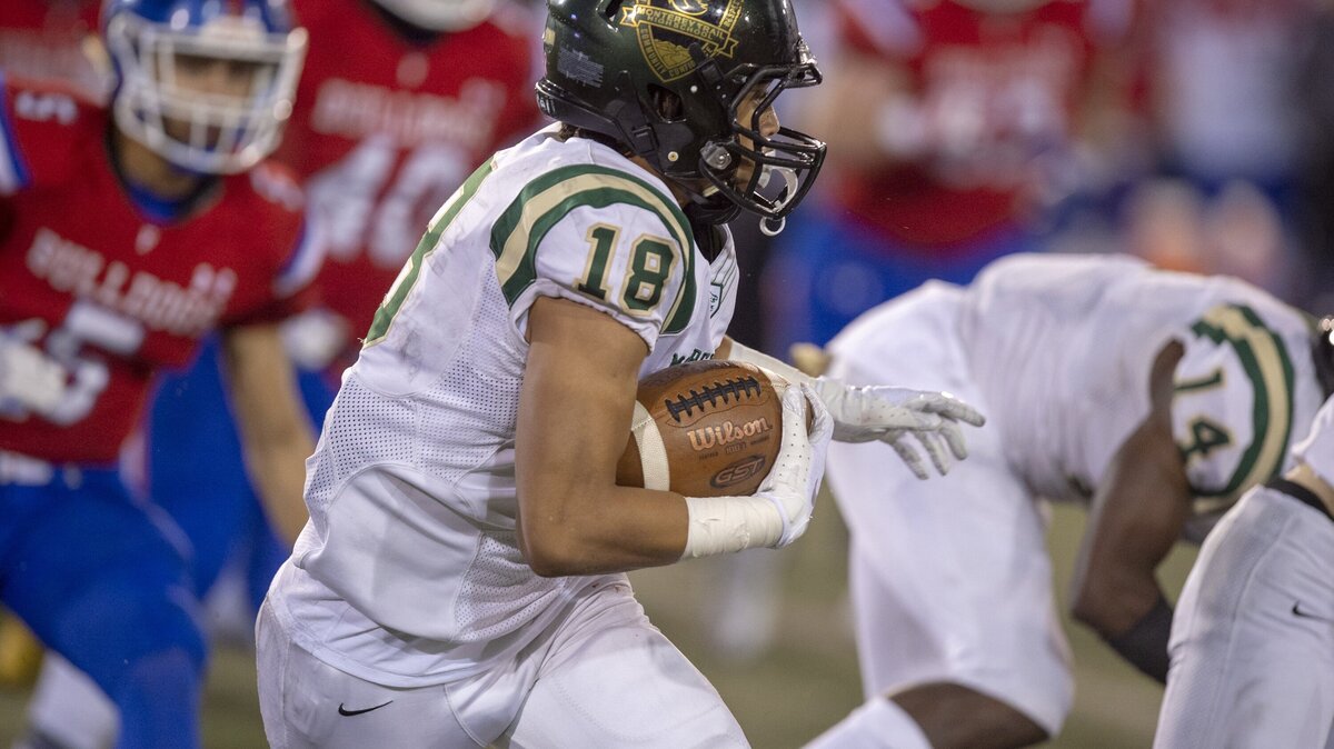 Mustangs Andre Crump (18) runs after a catch for 18 yards in the first quarter Section football championship game between Folsom vs. Monterey Trail, at Sacramento State on Saturday, December 1, 2018.