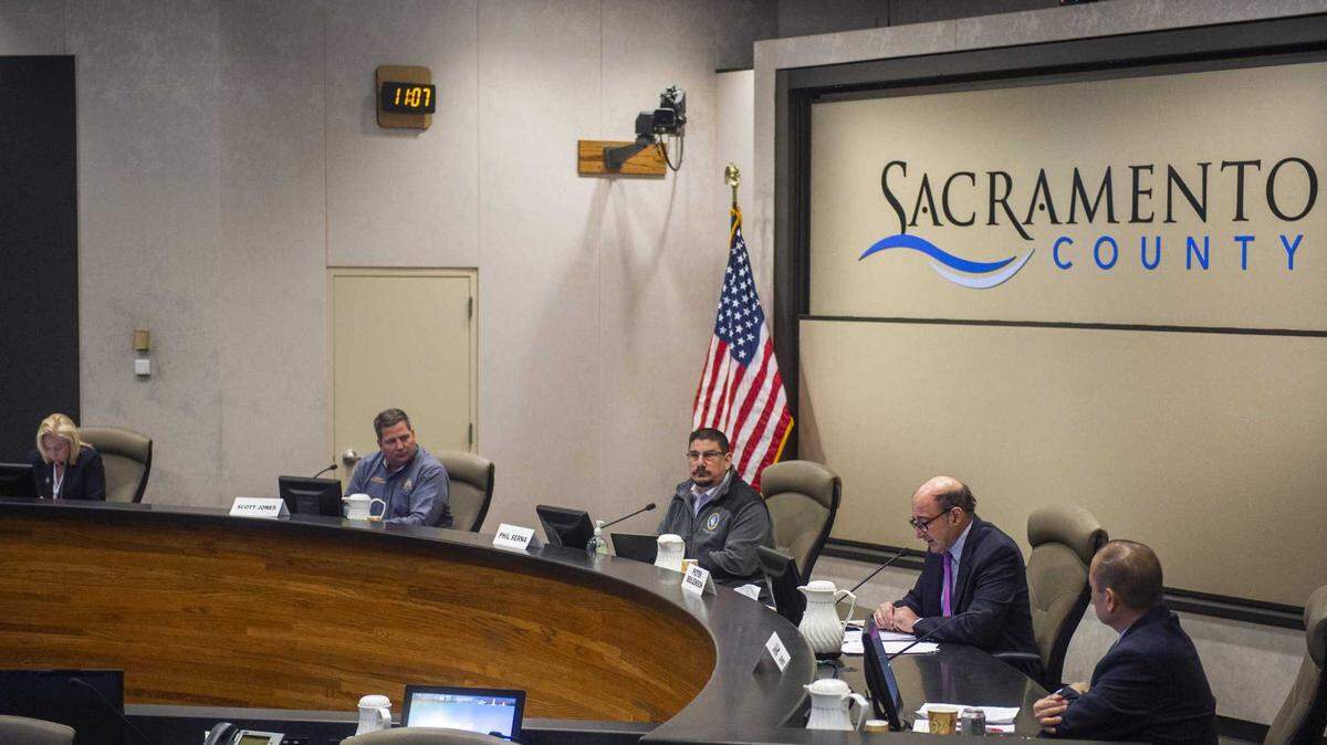 Sacramento County public officials including Supervisor Phil Serna, center, and Sheriff Scott Jones, second from left, gather in March 2020 to discuss coronavirus. The grand jury in a status review on June 7, 2022, criticized the Board’s response to a February 2022 grand jury investigation saying county leaders abdicated responsibility for COVID-19 spending in the early months of the pandemic.