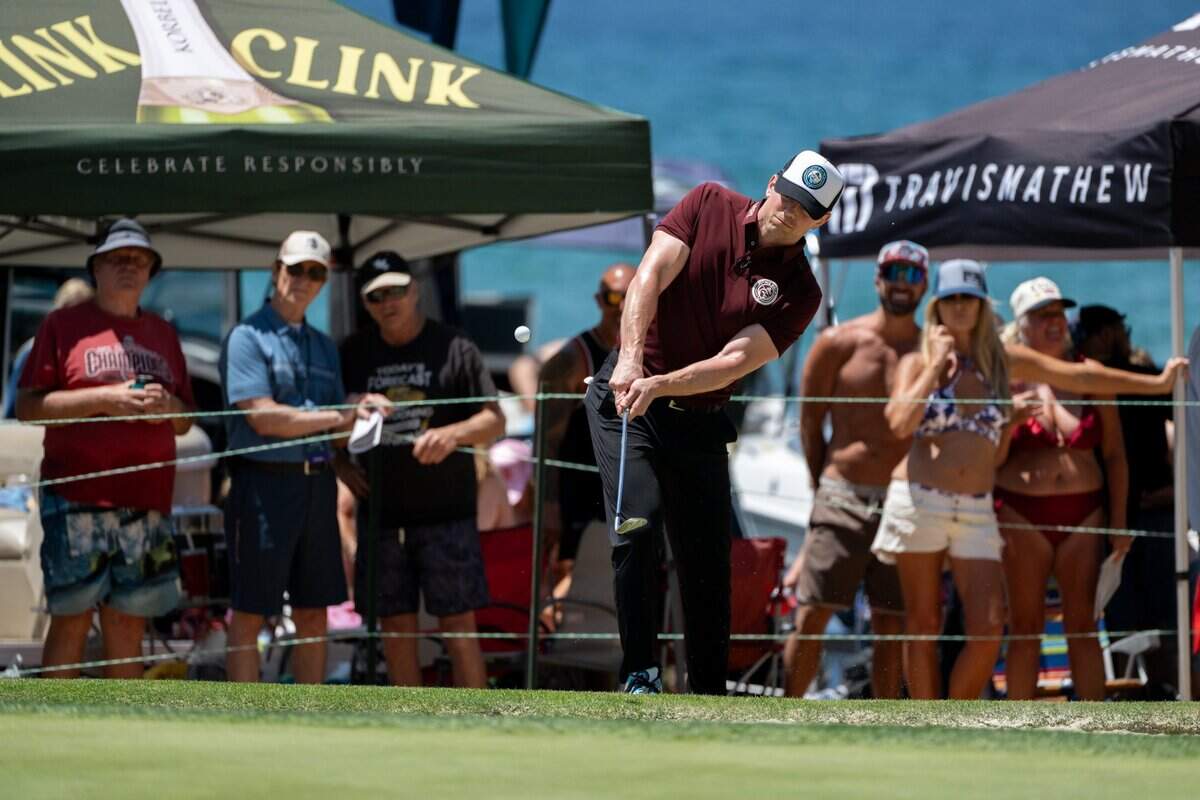 Fans line the beach as they watch retired professional wrestler The Miz hit onto the 17th green during the American Century Championship celebrity golf tournament at Edgewood Tahoe Resort in Stateline, Nev., on Friday, July 11, 2025.