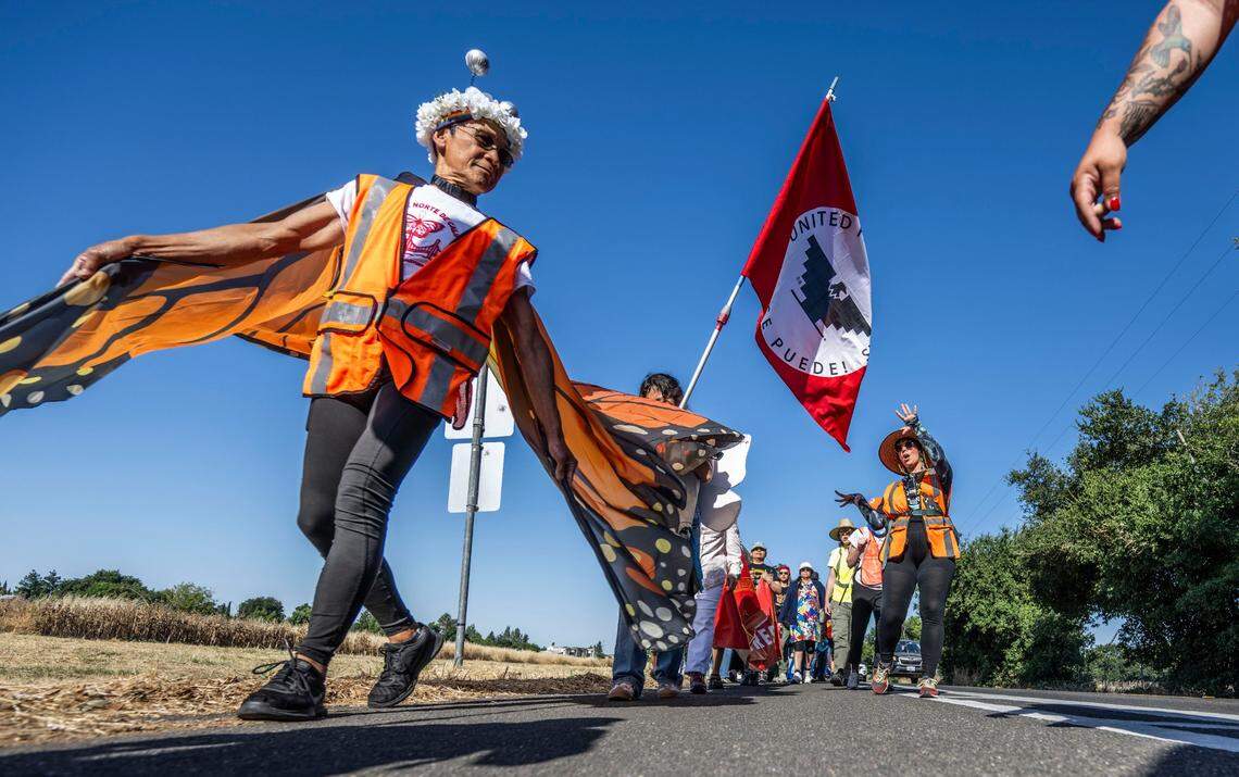 Sharat Lin, of San Jose, does a “peace dance” as part of a three-day march for immigrant rights outside of Davis on Monday. The march started on Saturday in Vacaville and was planned to conclude later in the day at the state Capitol in Sacramento.