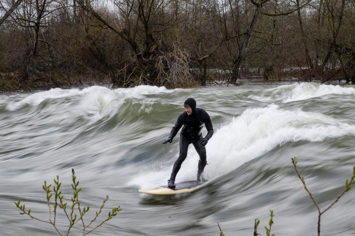 Mark Divittorio, of Placerville, rides a wave while river surfing Sunday, March 12, 2023, on the American River near Carmichael.