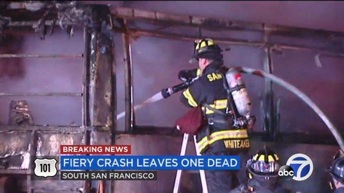 A firefighter douses a bus fire early Saturday near San Francisco. The acclaimed Aeolians choir from Oakwood University in Alabama escaped a fiery bus crash on HIghway 101, but the driver of another vehicle in the collision died, authorities say.