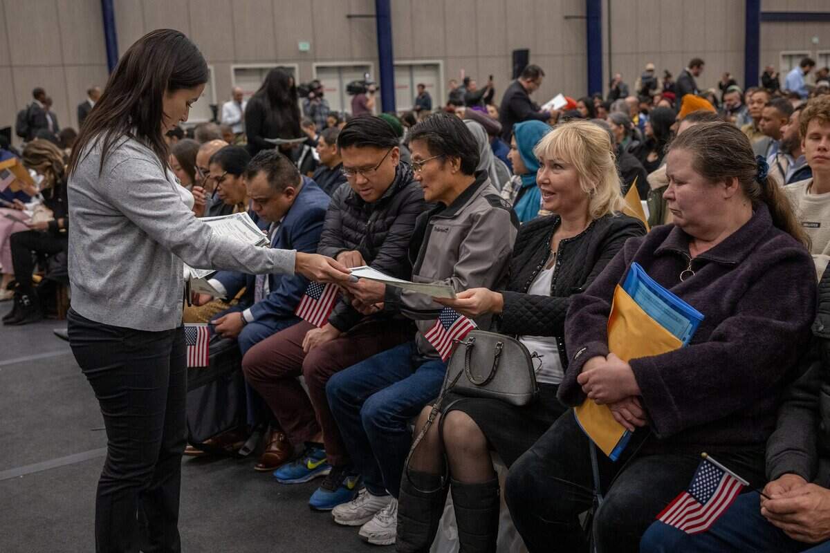 Olga Macri, second from right, originally from Russia, was happy to receive her certificate of citizenship at the U.S. Citizenship and Immigration Services naturalization ceremony in Roseville on Wednesday.