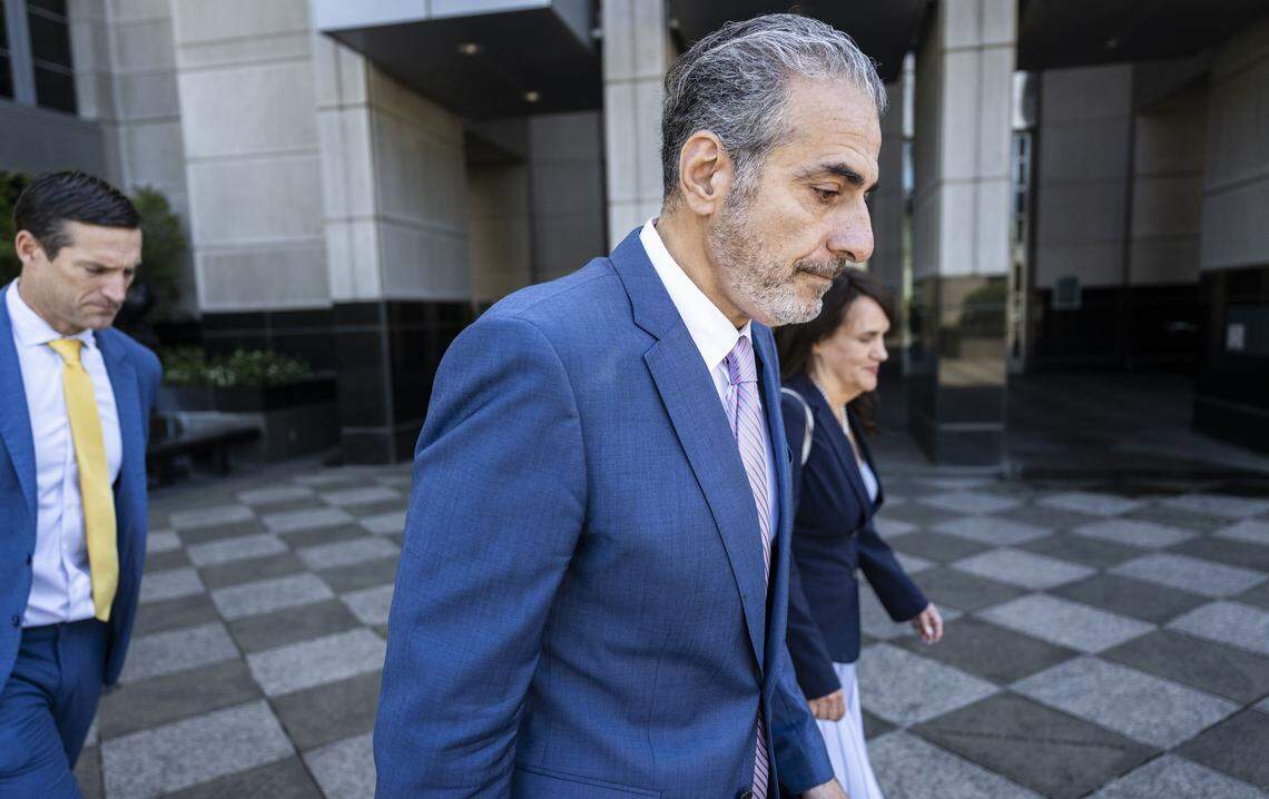 Former Sacramento City Councilmember Sean Loloee, center, leaves the Robert T. Matsui United States Courthouse in Sacramento on Thursday, April 23, 2026, after he plead guilty to charges involving fraud, tax violations and underpaying immigrant workers at his Viva Supermarket stores.
