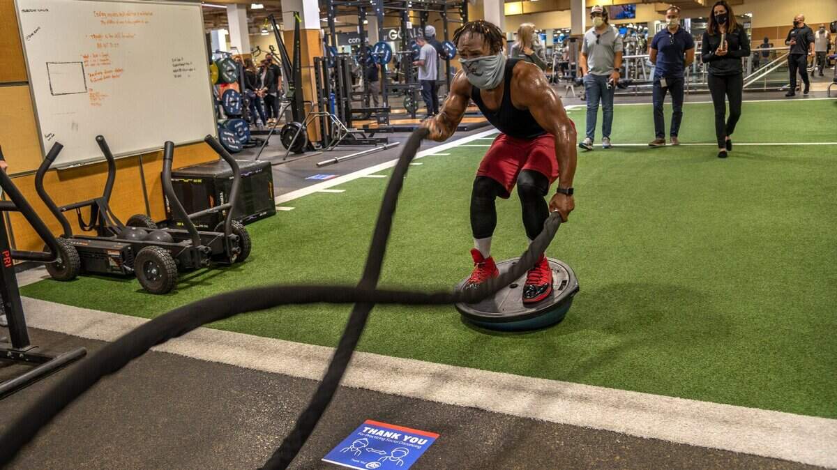 Exodus Rogers works out inside a 24 Hour Fitness gym in Sacramento on Oct. 28. Gyms and fitness centers in Sacramento and Placer counties are being forced to cease indoor operations after California moved the counties to the purple COVID-19 tier.