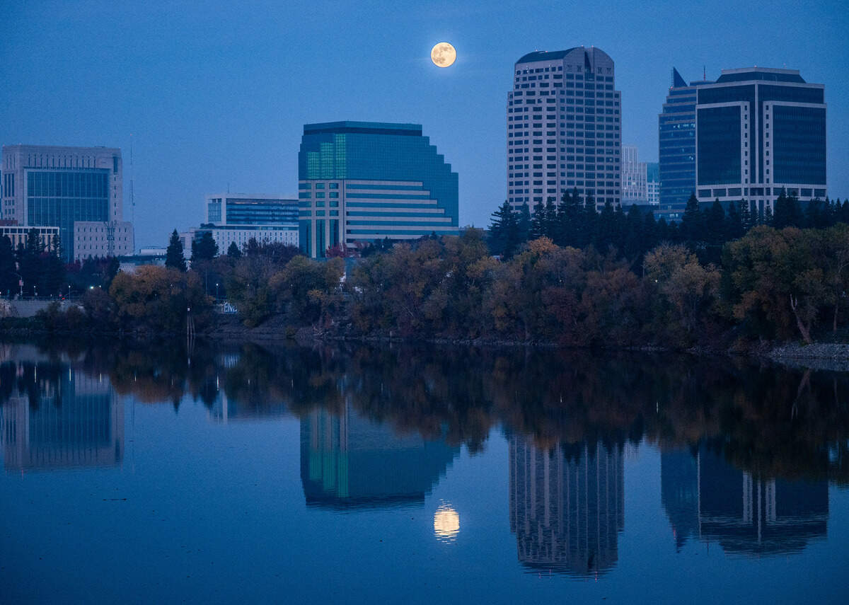 The supermoon rises over the Sacramento skyline on Thursday. The moon appears larger than usual because it’s at the closest point to the Earth in its elliptical orbit.