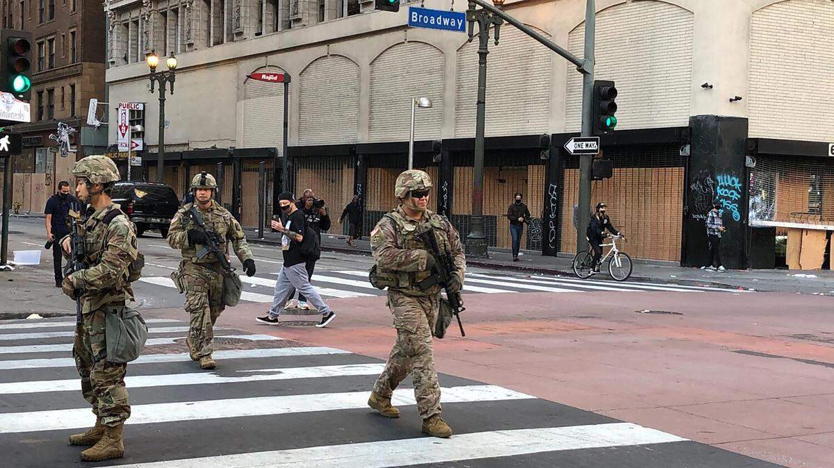 National Guard troops patrol downtown Los Angeles on Sunday, Dec. 7, 2025. A federal appeals court has temporarily blocked the Trump administration from deploying California National Guard soldiers in Los Angeles, siding in part with Gov. Gavin Newsom in an ongoing legal battle over state control of the troops.
