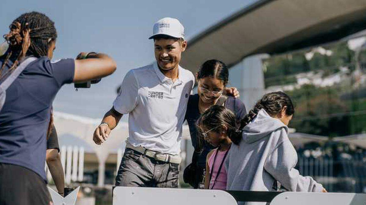 Jayden Lizama celebrates with family after winning the Curry Cup on Saturday, Sept. 13, 2025, at Liberty National Golf Club in Jersey City, N.J. Lizama, who joined the Underrated Golf Tour in 2023, ended his junior golf career with his first championship win before transitioning to collegiate competition at Gonzaga University.