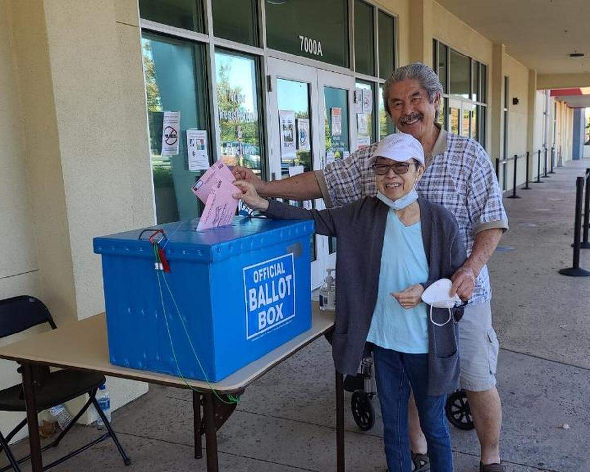 Georgette Imura and her husband, Roy, submit their ballots for the Nov. 2020 presidential election One of Imura’s goals was to live long enough to vote against Donald Trump.