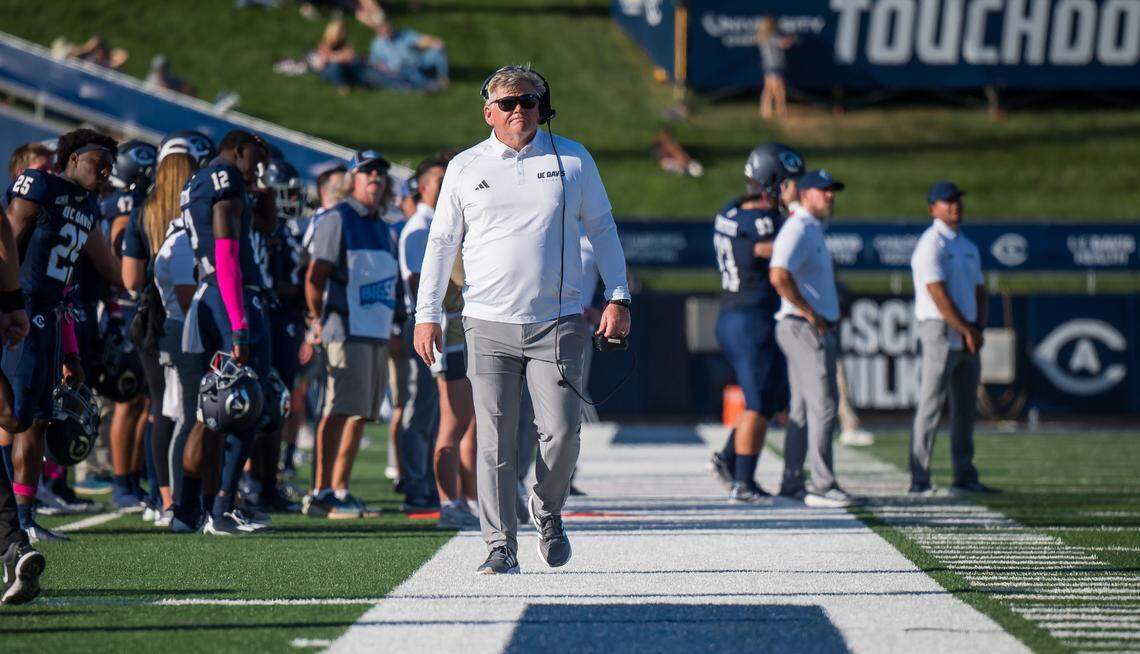 UC Davis Aggies head coach Dan Hawkins walks the sideline during a timeout in the first half as they play the Montana Grizzlies at the NCAA college football game Saturday, Oct. 7, 2023, at UC Davis Health Stadium.