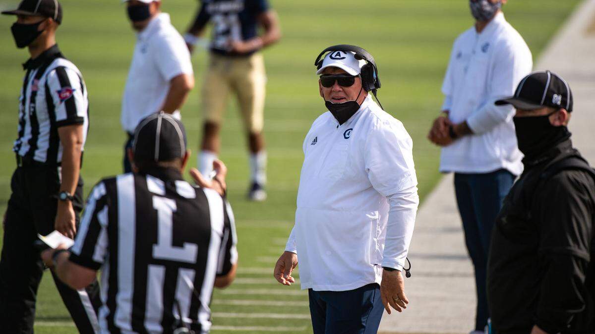 UC Davis head coach Dan Hawkins, center, expresses disagreement with some of the officiating during the game against Eastern Washington during the fourth quarter of the college football game Saturday, April 3, 2021, at UC Davis Health Stadium. It was the first game open for fans and last home game of the season for the Aggies.