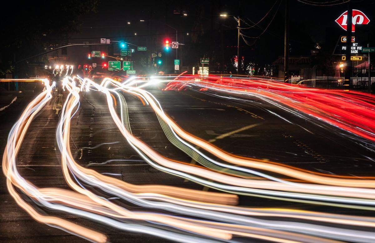 Traffic moves on Douglas Boulevard on Wednesday, Oct. 13, 2021, between Interstate 80 and downtown Roseville in a long-exposure photo looking east to Harding Boulevard from Royer Park.As part of the citys commercial corridors project, the area will get include pedestrian-friendly improvements and mixed-use development.