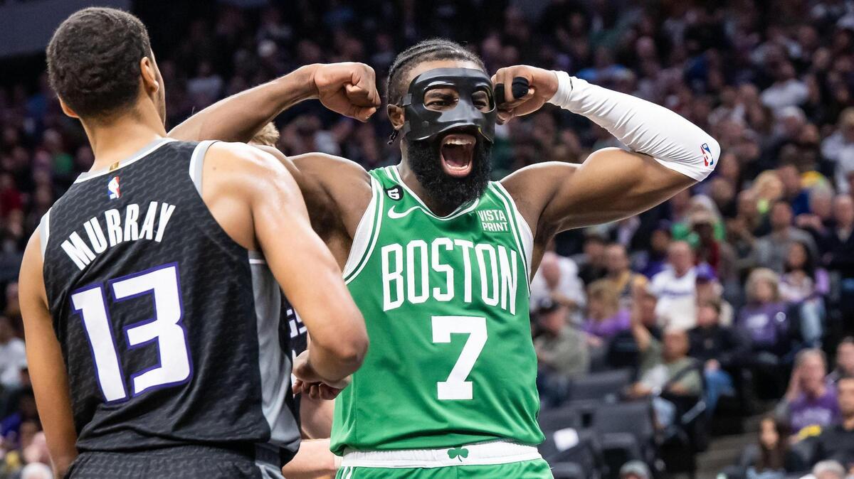 Boston Celtics guard/forward Jaylen Brown (7) celebrates scoring during the fourth quarter in front of Sacramento Kings forward Keegan Murray (13) at the NBA basketball game Tuesday, March 21, 2023, at Golden 1 Center. The Celtics beat the Kings, 132-109.