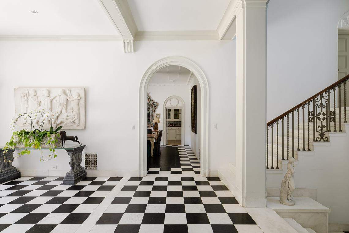 In addition to the grand main residence, seen here, a separate guest house offers a cozy 1-bedroom suite, living room with fireplace, full kitchen, and secluded garden.