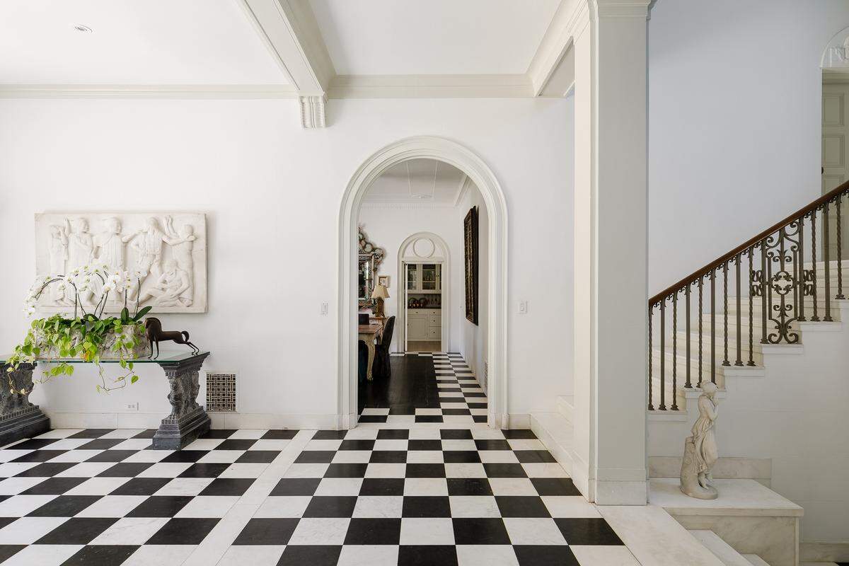 In addition to the grand main residence, seen here, a separate guest house offers a cozy 1-bedroom suite, living room with fireplace, full kitchen, and secluded garden.