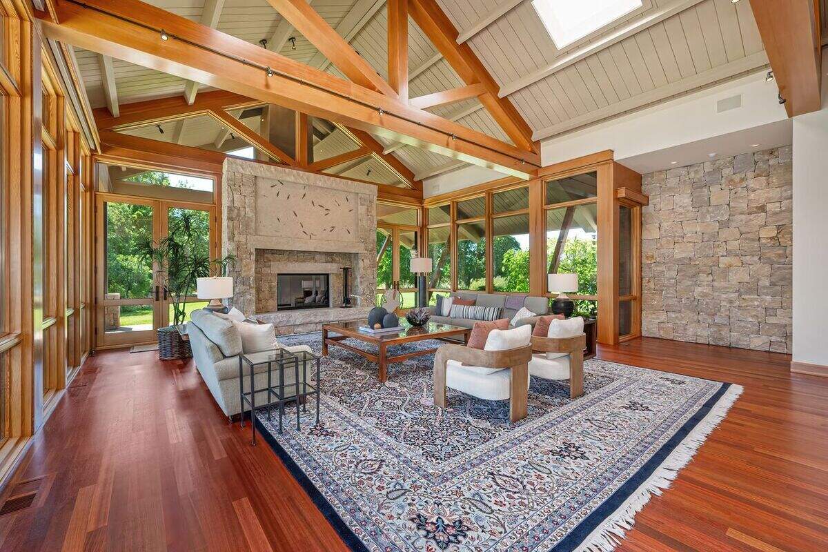 The architecture is intentionally clean and contemporary, understated but elegant. The living room opens up under 30-foot with exposed Douglas fir beams.