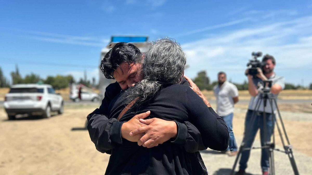 Mercedes Lemos, the grandmother of three men missing in the Esparto fireworks warehouse blast, hugs her son, Saul, the uncle of the men at a Sheriff’s Office checkpoint near the town of Esparto on Thursday, July 3, 2025. The men — Jesus and Jhonny Ramos Jr. and stepbrother Joel Melendez — were among seven people “unaccounted for” following the massive explosion and inferno.