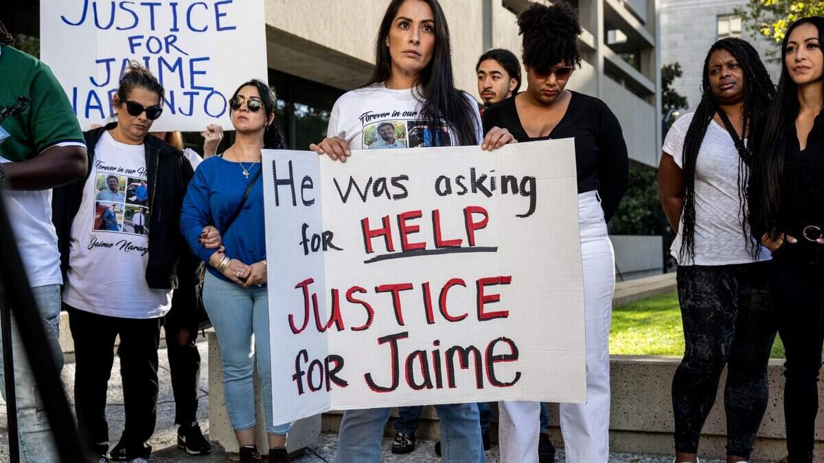 Eliana Echeverria, daughter of Jaime Naranjo, holds a sign on Tuesday, Oct. 4, 2022, as she joined family members and supporters at a press conference in Sacramento about the death of her father, who was shot by a Sacramento Sheriff’s deputy last week.