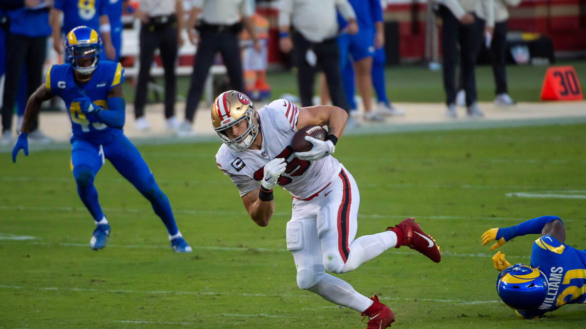 San Francisco 49ers tight end George Kittle (85) breaks tackle by Los Angeles Rams defensive back Darious Williams (31) and runs for a touchdown in the second quarter during a game at Levi’s Stadium on Sunday, Oct. 18, 2020 in Santa Clara.