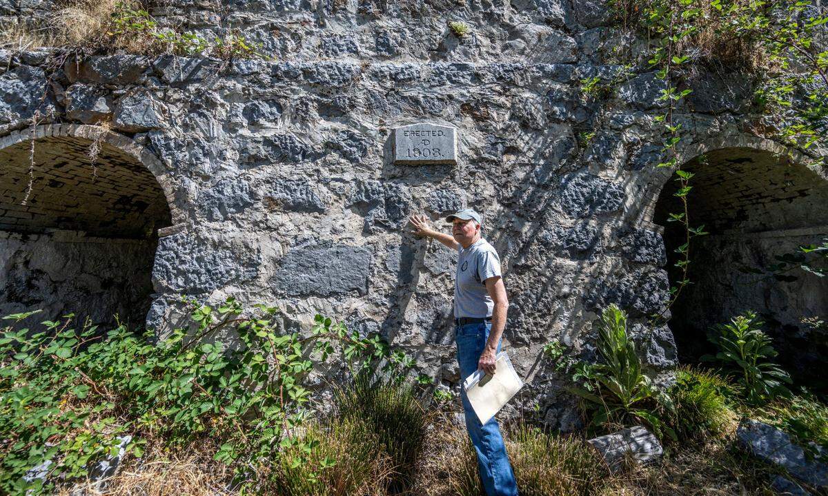Jim Wood, a board member with the nonprofit Colfax Lime Kiln Preserve, stands near an historic lime kiln last month that was rediscovered after a 2021 wildfire in Placer County.