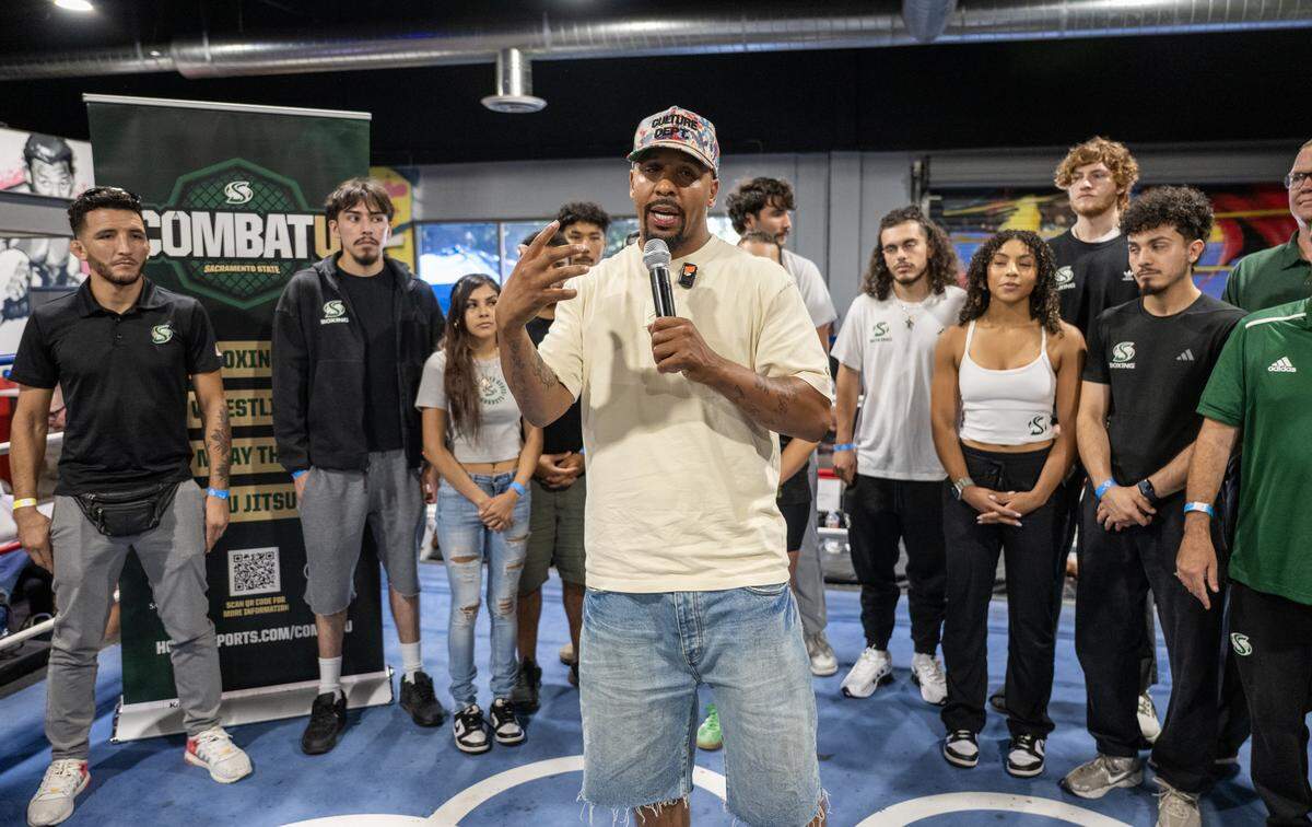 Two-time world boxing champion Andre Ward announces to the crowd at Flawless Fitness on Saturday that he’s joining Sacramento State’s Combat U program as general manager.