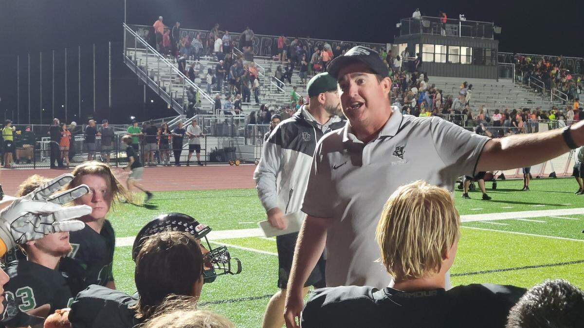 Twelve Bridges coach Chris Bean talks with his players after a 39-27 win over Center on Friday, Sept. 30, 2022.
