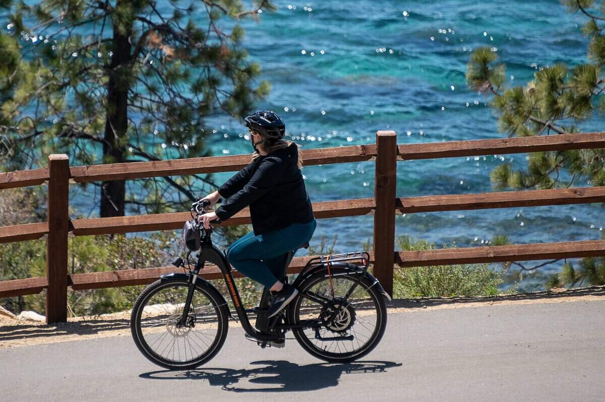 A cyclist rides an e-bike on the Tahoe East Shore Trail along Highway 28 near Incline Village, Nevada, on Friday, May 7, 2021.