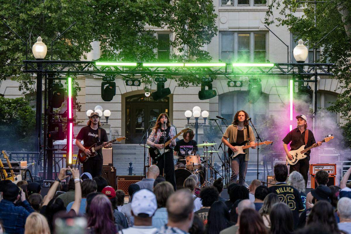 Alt rock group Rainbow City Park, with Danielle Judith on lead vocals and guitar, performs at Concerts in the Park across from Sacramento City Hall on Friday.