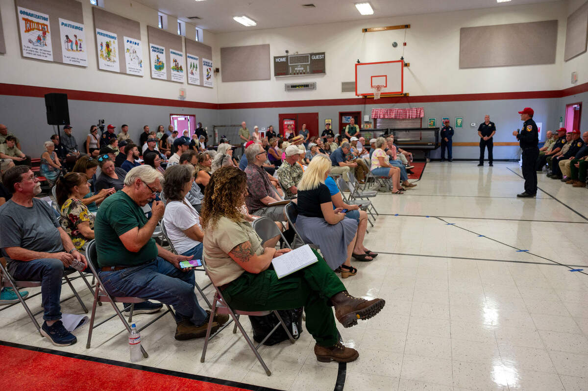 People packed the multi-purpose room at Sutter’s Mill School in Placerville during a Crozier Fire town hall meeting by Cal Fire and El Dorado County officials on Sunday.