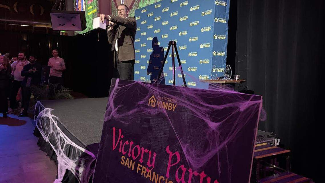 California YIMBY CEO Brian Hanlon gestures to the crowd during a victory party for the organization held in San Francisco on Thursday.