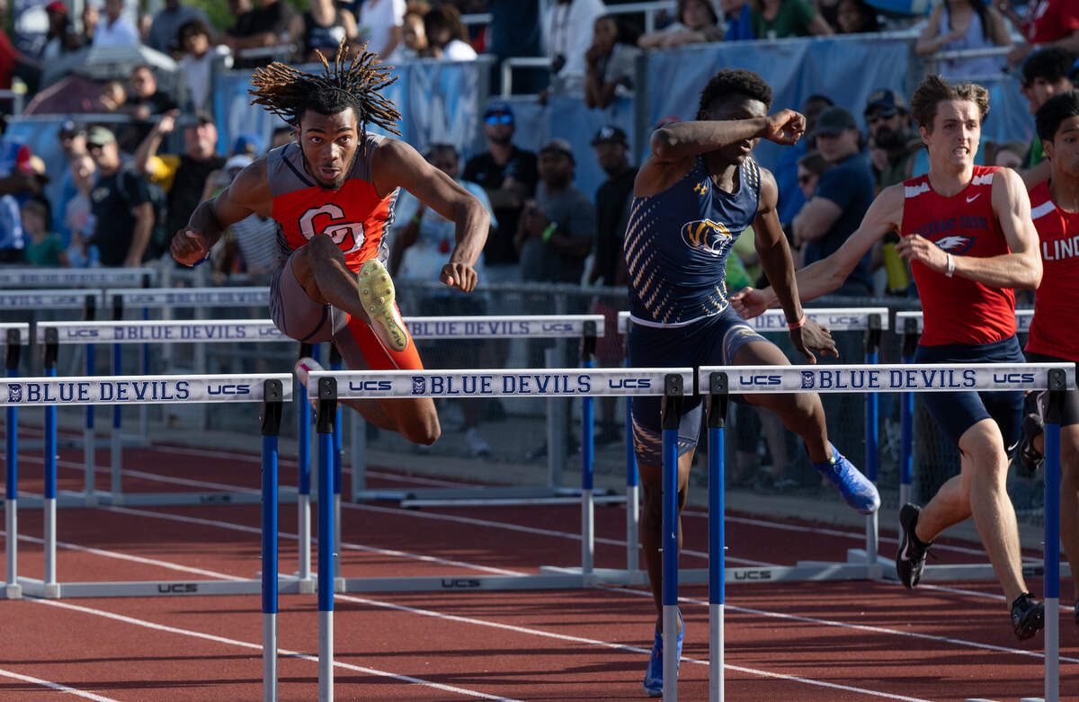 Cosumnes Oaks’ Myles McFarland, left, won the boys 110-meter hurdles with a time of 13.90 at the CIF Sac-Joaquin Section Masters Track and Field Championships at Davis High School in Davis, Calif., Saturday, May 18, 2024. Rickey Green III of Inderkum, middle, placed second at 13.96 and Pleasant Grove’s Matthew McHale, right, was third with a time of 14.20.